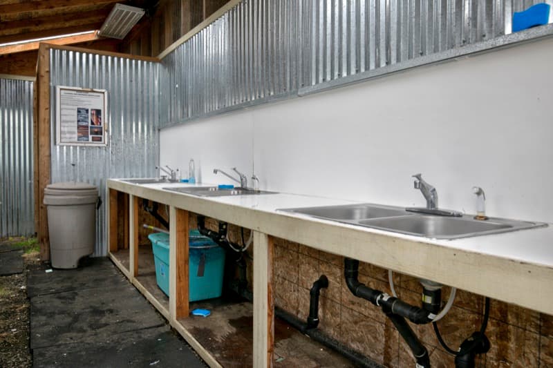 Clam cleaning station with sinks at the resort