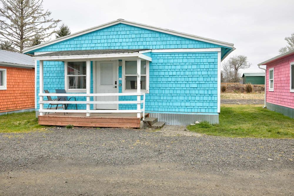 Cottage 5 exterior — bright blue shingle cottage